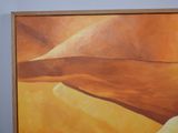 a painting on the wall of a room with a painting of a desert
