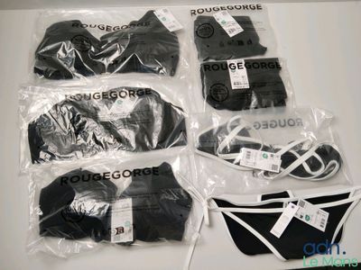 six pairs of underwear wrapped in plastic bags on a table