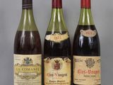 three bottles of wine are lined up on a table