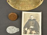 an old photo of a medal, a coin, and a picture of a man