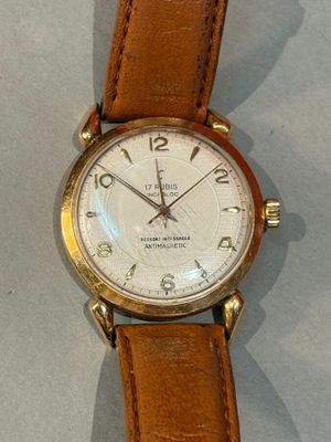 a watch that is on display on a table