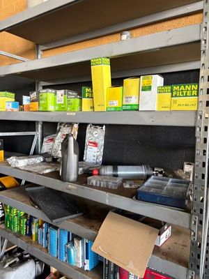 many shelves with various items on them in a store