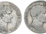 a silver coin with an image of a man on it