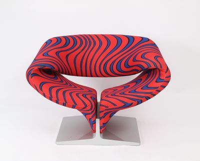 red, blue and black zebra print chair on a metal stand