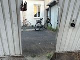 a bike that is sitting in the doorway of a building
