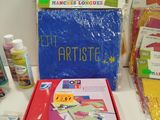 a box of arts and crafts supplies on a table