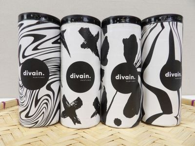 three different types of divinn bottles sitting on top of a table