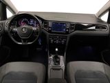 the interior of a car with a steering wheel, dashboard, and dashboard controls