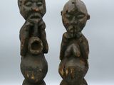 pair of african carved wood figurines of a man and a woman