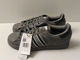 adidas superstar shoes with price tag on a white surface
