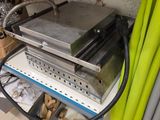 a machine that is sitting on a shelf in a room