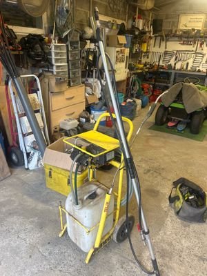 a yellow cart with a hose and a yellow cart with a hose in it