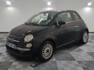a picture of a small black car on a checkered floor