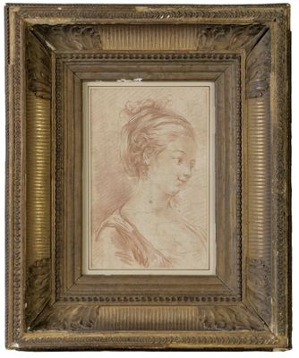 un dessin représentant la tête d'une femme dans un cadre doré