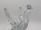 clear glass bird figurine sitting on top of a white surface