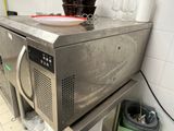 an image of a kitchen with a microwave on the counter