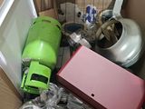 a cardboard box filled with assorted items including a blow dryer