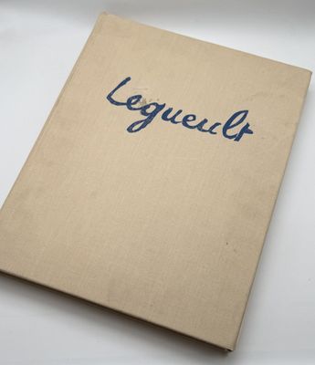 a close up of a book on a table with a white background