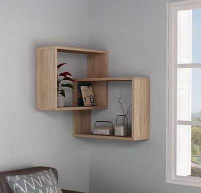 a picture of a living room with a couch and a book shelf