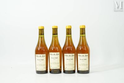 three bottles of wine sitting next to each other on a white surface