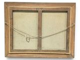 a picture of an old window with a rope hanging from it