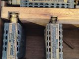 a wooden box with three different type of valves in it