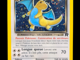 pokemon card with a yellow border and a blue dragon on it