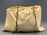 a large yellow bag with the word loewe written on it