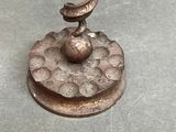 a metal object with a spiral design on top of it
