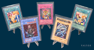 four cards on a small easer on a blue background