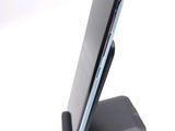 a cell phone that is sitting on top of a stand