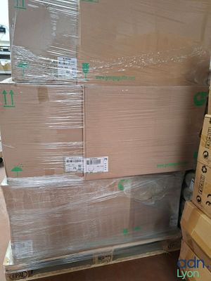 a large stack of boxes sitting on a pallet in a warehouse