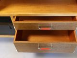 a wooden desk with two drawers on it