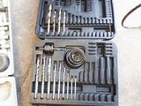 a tool kit that is sitting on the ground next to a tool box