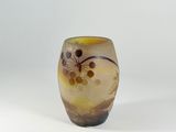 a glass vase with a flower design on it