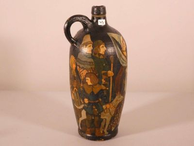 a vase with a painting on it sitting on a table