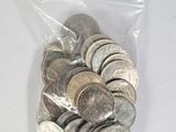 a bag full of coins sitting on a table