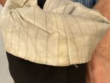 a person holding a bag that has a wrist on it