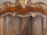 a large wooden cabinet with a mirror on top of it
