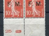 a couple of stamps that are sitting on top of a table