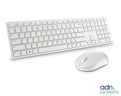 a computer keyboard and mouse sitting next to each other