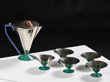 five cups and a pitcher on a white table