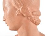 an image of a clay head of a woman on a white background