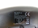 a close up of a metal object with a button on it