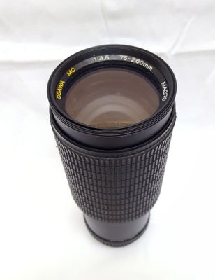 a camera lens that is sitting on a white surface