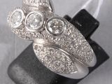 an image of a silver ring with three stones on top of it
