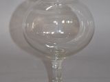 a glass vase that is sitting on a table