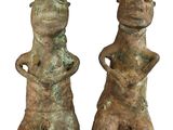 pair of bronze figurines of a man and a woman