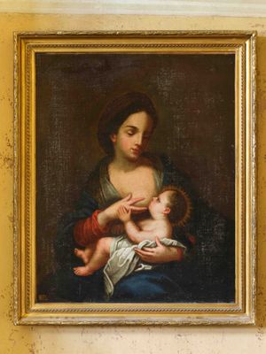 peinture d'une femme tenant un bébé dans ses bras