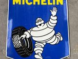 a michel michel sign hanging on the side of a building